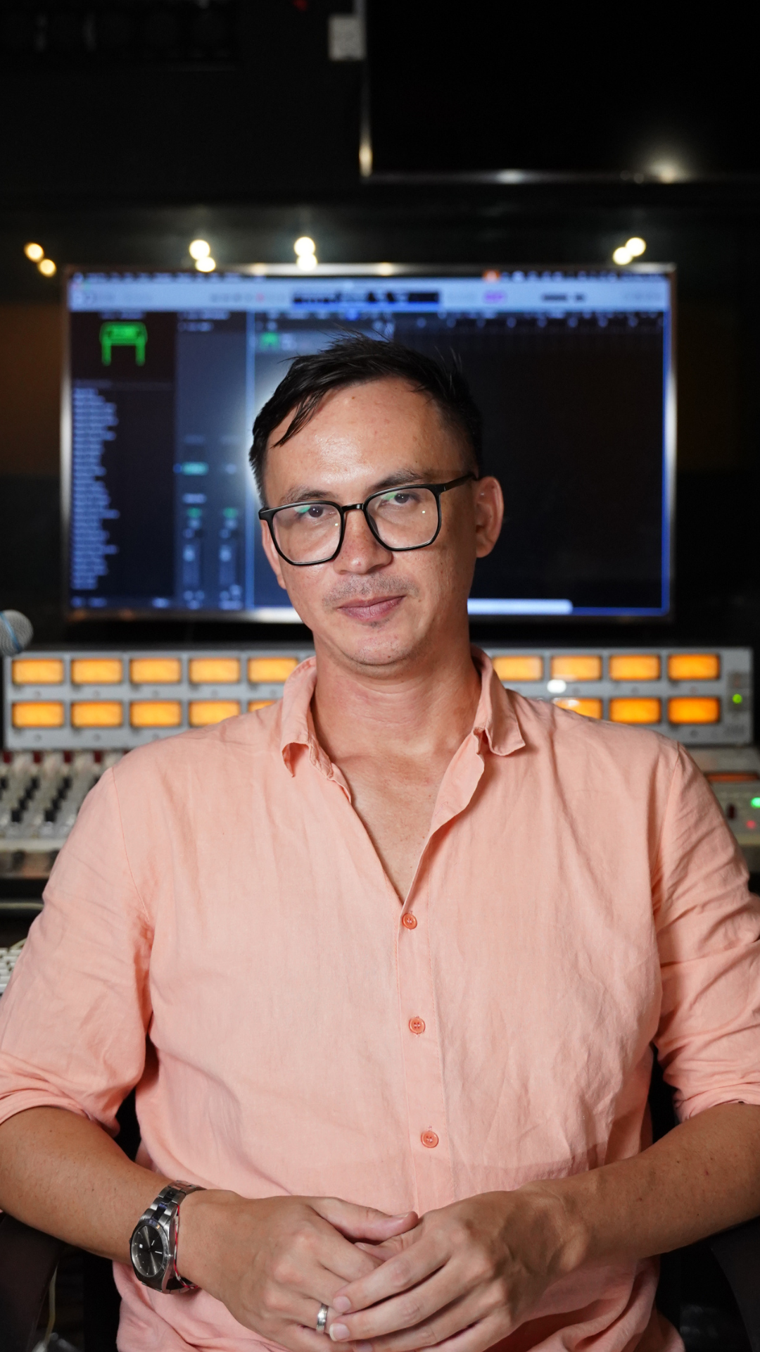 Portrait of digital music production facilitator in a studio setting